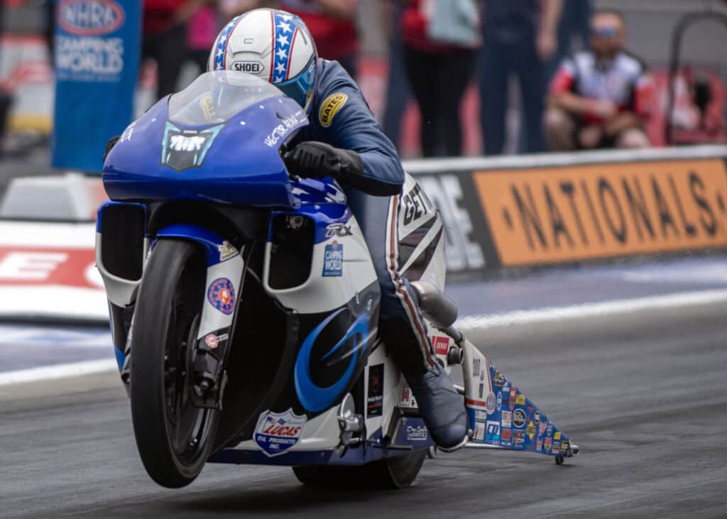 an nhra motorcycle racer in motion
