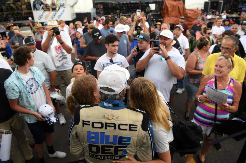 john force mingles with fans at an NHRA event